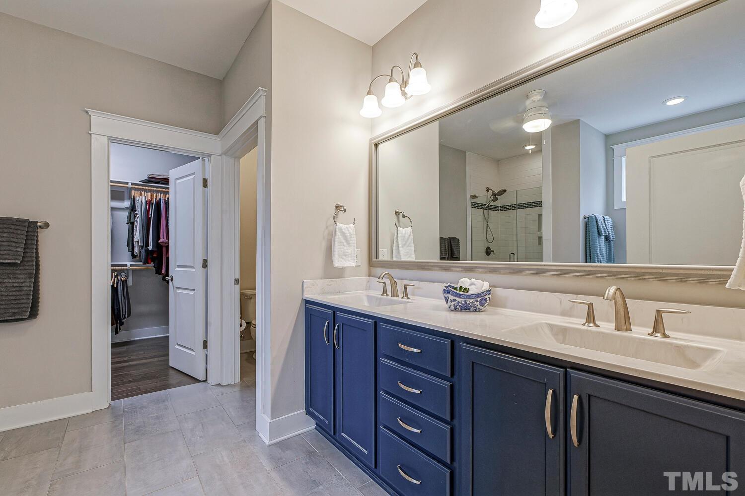 1125 Barley Stone Way Raleigh, NC 27603 - Photo 44 of 89 With Gorgeous Blue Vanity & Accent Tile in the Shower!