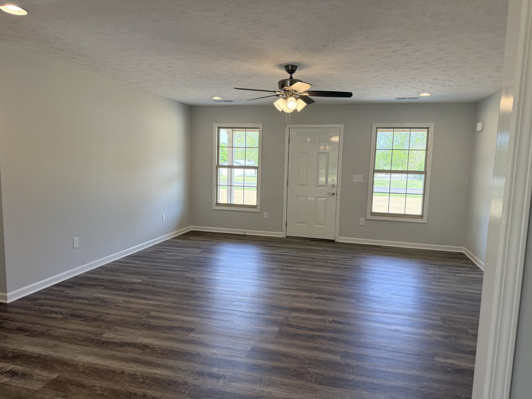 6265 Lynchburg Road Winchester, TN 37398 - Photo 6 of 55 an empty room with wooden floor and window