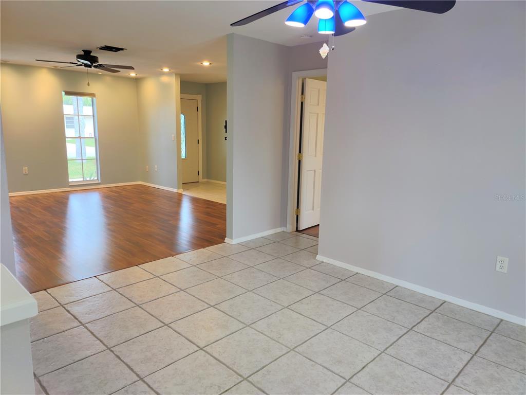 979 Nantucket Road Venice, FL 34293 - Photo 18 of 34 wooden floor in an empty room with a window