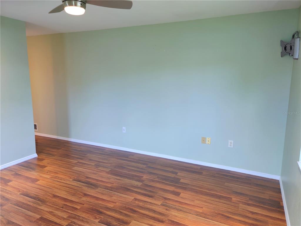 979 Nantucket Road Venice, FL 34293 - Photo 20 of 34 a view of an empty room with wooden floor