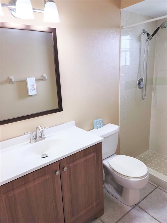 979 Nantucket Road Venice, FL 34293 - Photo 29 of 34 a bathroom with a sink a toilet and shower