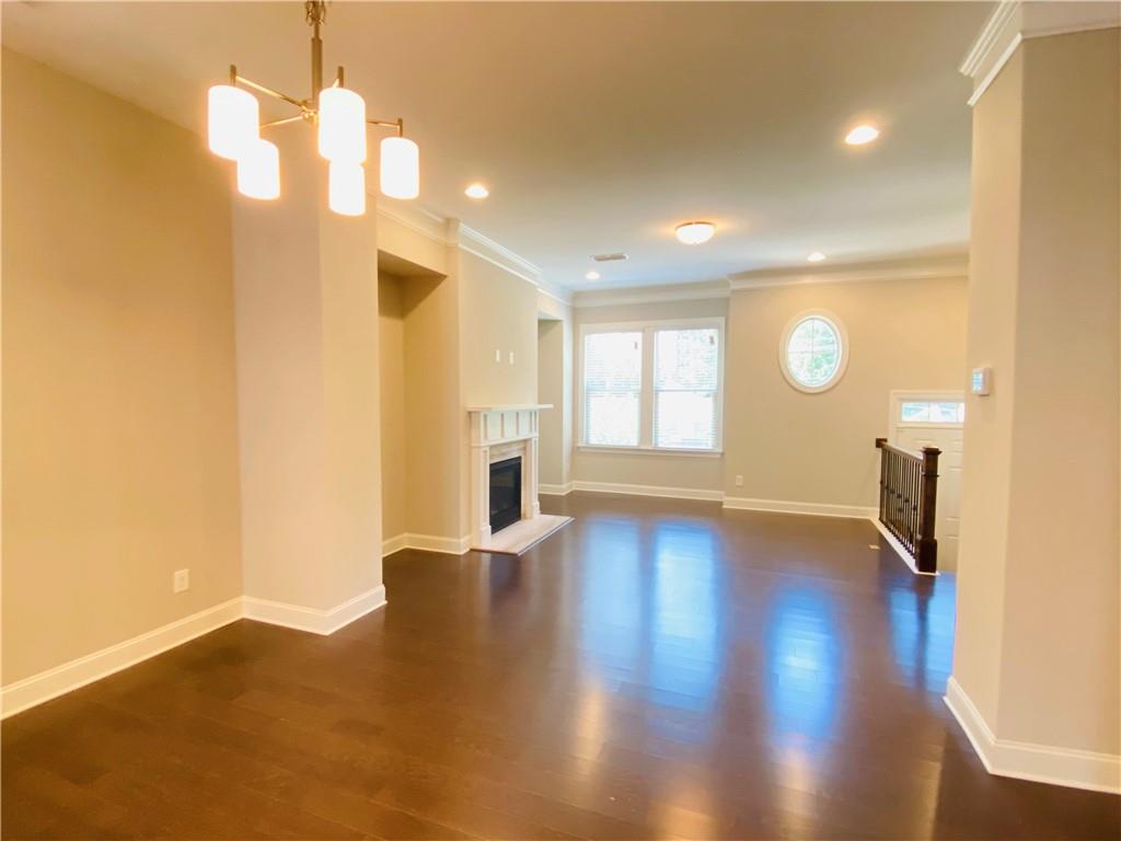 1815 Hislop Lane, Unit 8 Atlanta, GA 30345 - Photo 12 of 38 a view of empty room with wooden floor and fan
