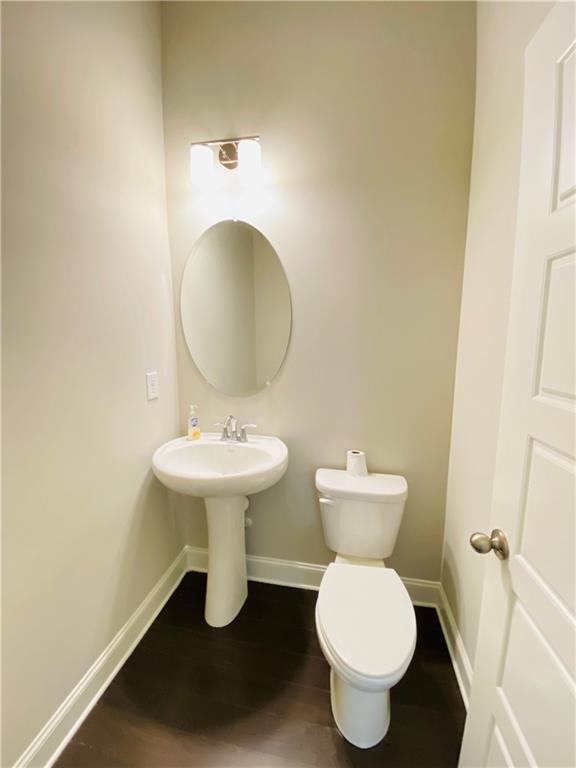 1815 Hislop Lane, Unit 8 Atlanta, GA 30345 - Photo 13 of 38 a bathroom with a toilet sink and mirror