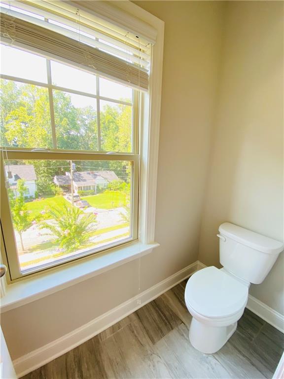 1815 Hislop Lane, Unit 8 Atlanta, GA 30345 - Photo 20 of 38 a bathroom with a toilet a sink and a window