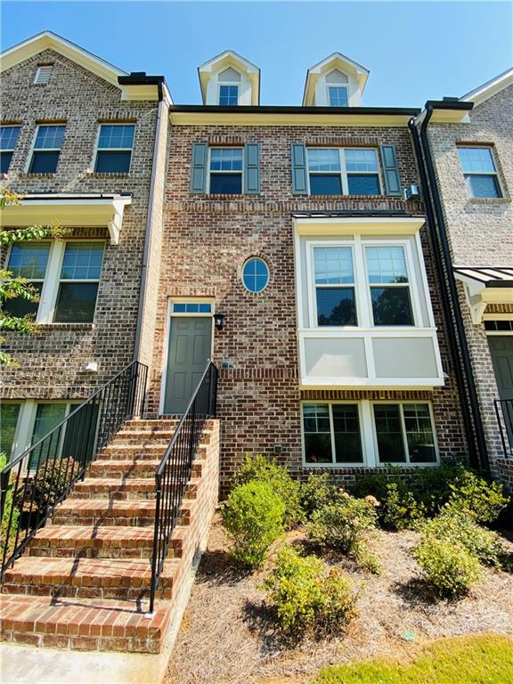 1815 Hislop Lane, Unit 8 Atlanta, GA 30345 - Photo 2 of 38 a front view of a multi story residential apartment building