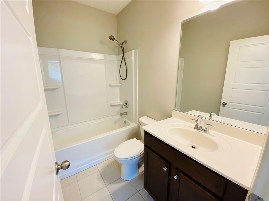 1815 Hislop Lane, Unit 8 Atlanta, GA 30345 - Photo 28 of 38 a bathroom with a sink a toilet and shower