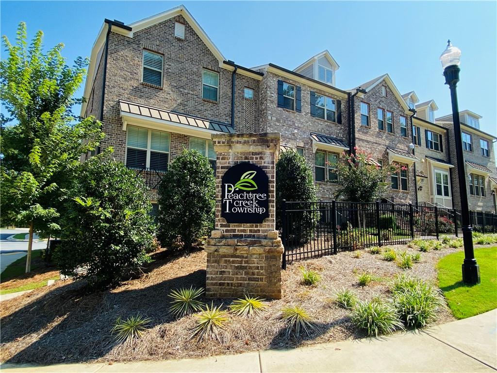 1815 Hislop Lane, Unit 8 Atlanta, GA 30345 - Photo 38 of 38 a front view of a building with garden
