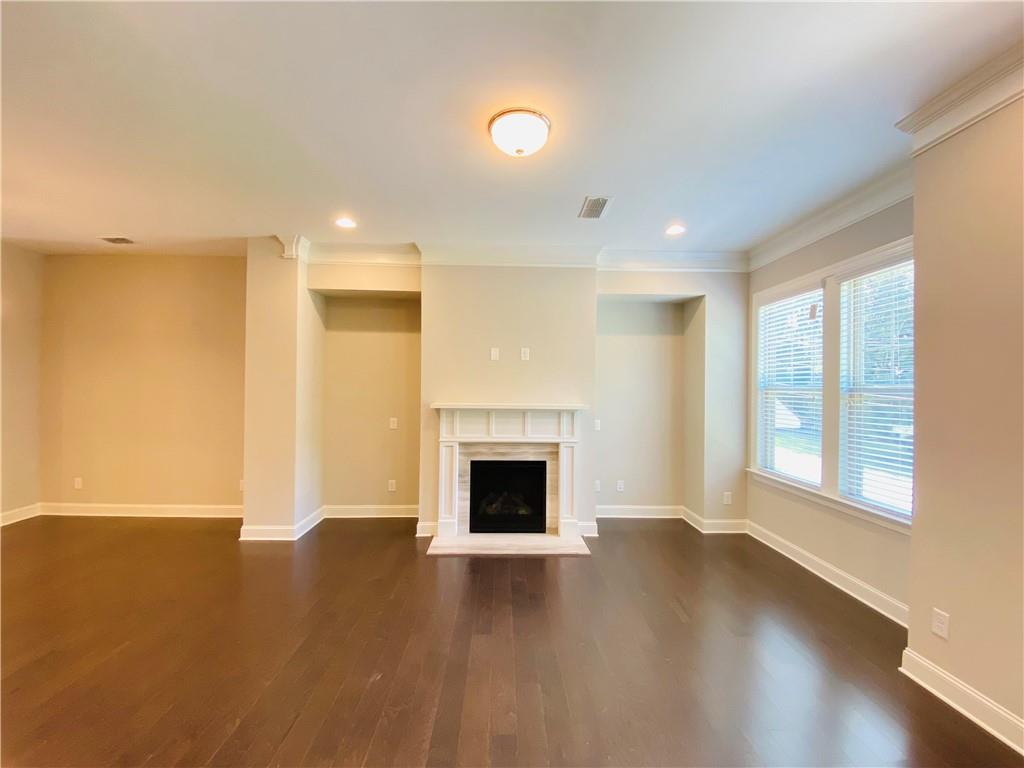 1815 Hislop Lane, Unit 8 Atlanta, GA 30345 - Photo 5 of 38 an empty room with windows and fireplace