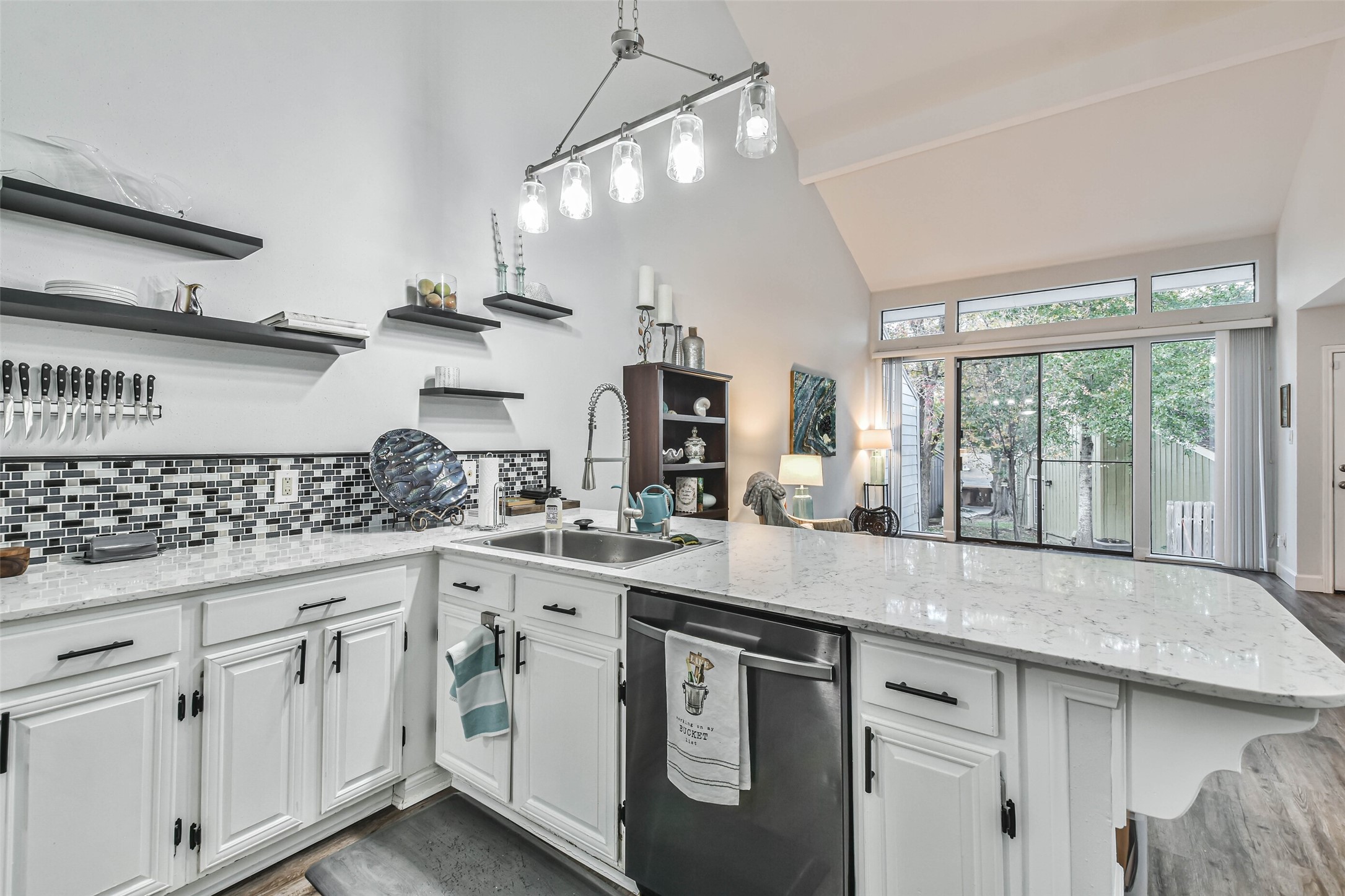 50 April Village Conroe, TX 77356 - Photo 8 of 19 a kitchen with white cabinets and window