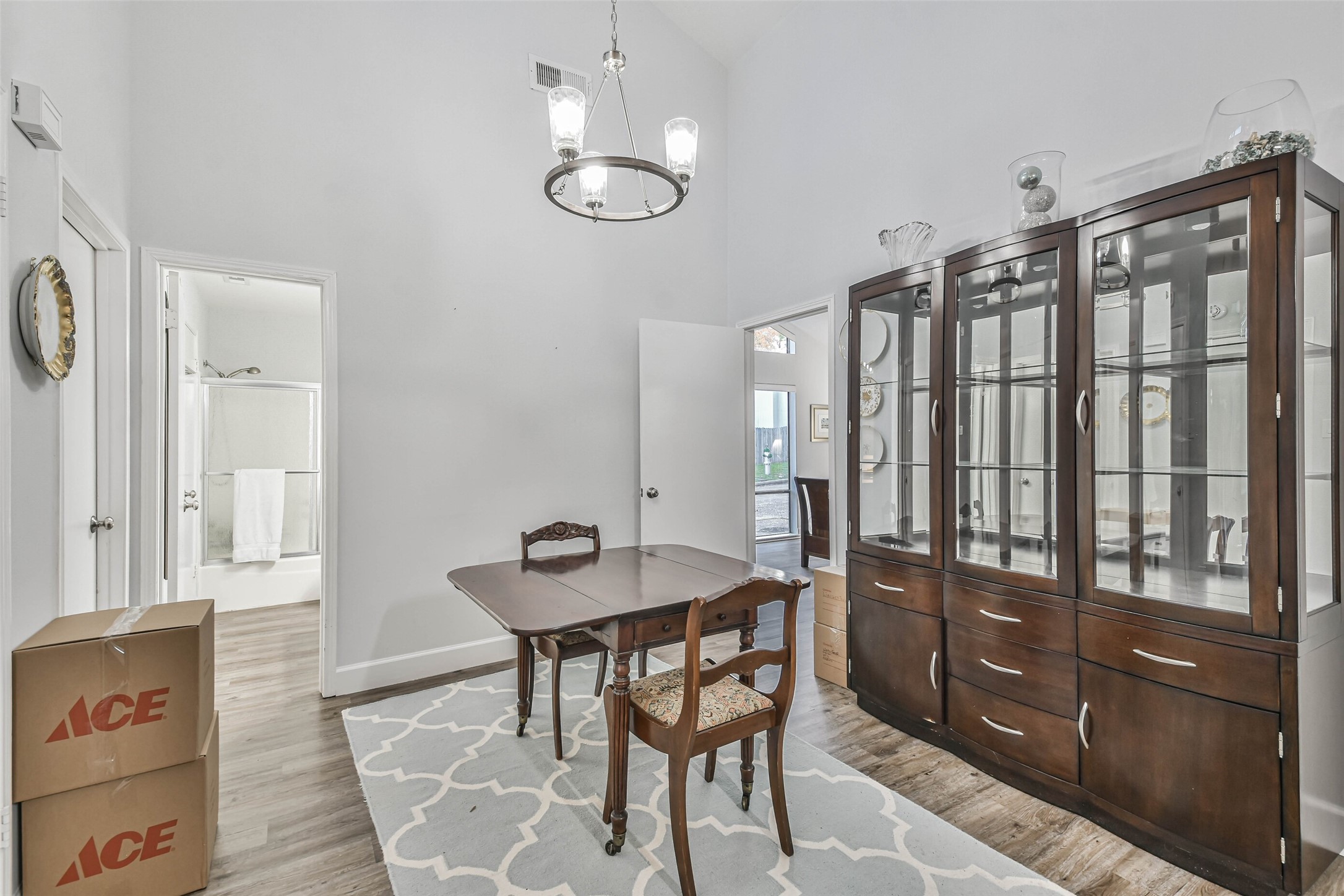 50 April Village Conroe, TX 77356 - Photo 9 of 19 a view of a dining room with furniture and chandelier