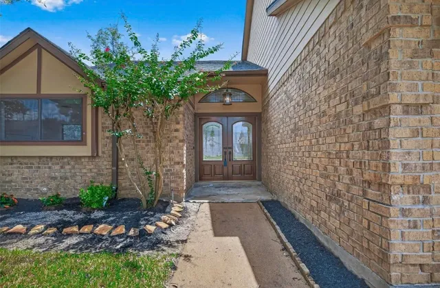 a front view of a house with garden