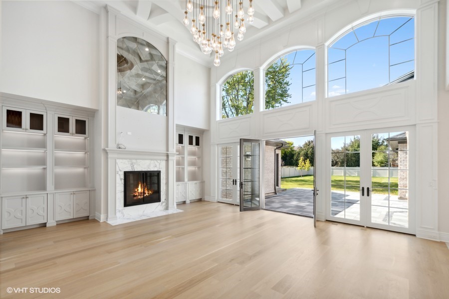 502 Greenwood Road Northbrook, IL 60062 - Photo 11 of 60 a view of an empty room with a fireplace and a window