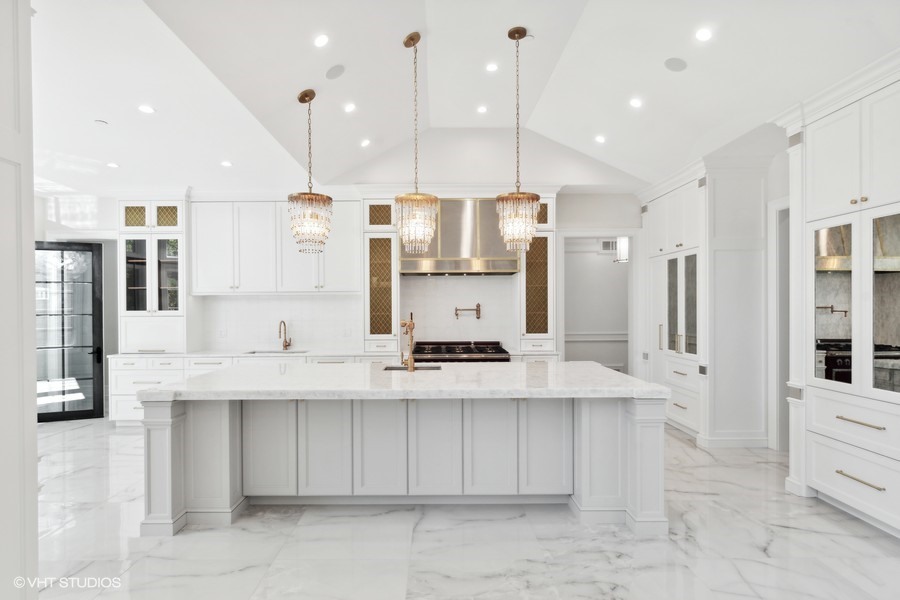 502 Greenwood Road Northbrook, IL 60062 - Photo 16 of 60 a large kitchen with a large counter top stainless steel appliances and cabinets