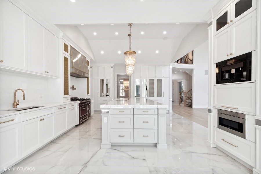 502 Greenwood Road Northbrook, IL 60062 - Photo 19 of 60 a large kitchen with stainless steel appliances a stove sink and cabinets