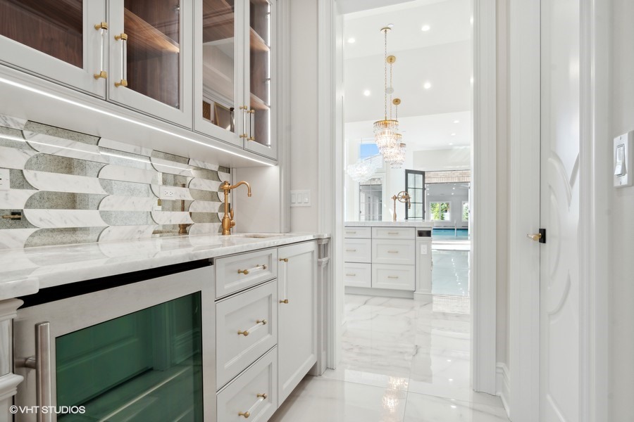 502 Greenwood Road Northbrook, IL 60062 - Photo 21 of 60 a bathroom with a granite countertop sink and a mirror