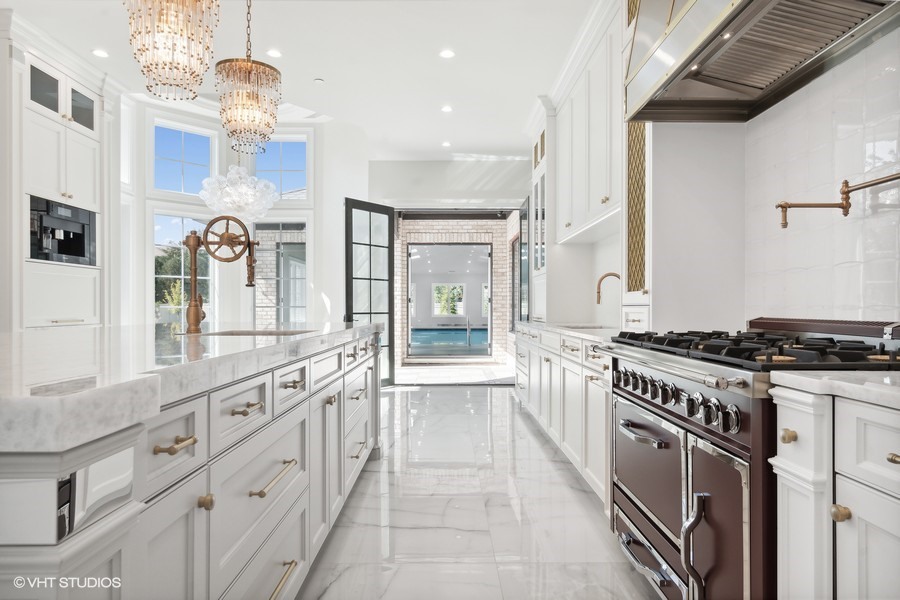 502 Greenwood Road Northbrook, IL 60062 - Photo 22 of 60 a large kitchen with stainless steel appliances granite countertop a stove and a sink