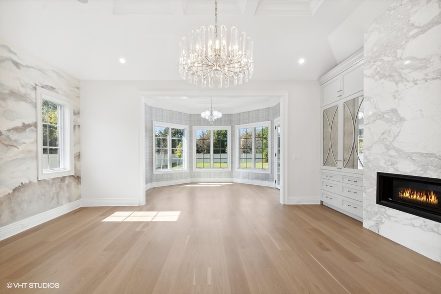 502 Greenwood Road Northbrook, IL 60062 - Photo 30 of 60 a view of an empty room with wooden floor and a fireplace