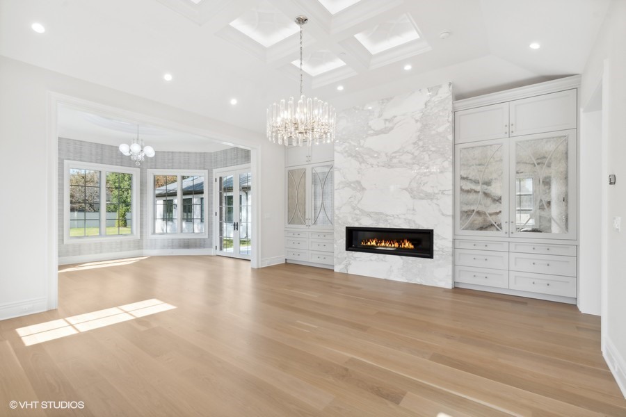 502 Greenwood Road Northbrook, IL 60062 - Photo 32 of 60 an empty room with wooden floor fireplace and windows