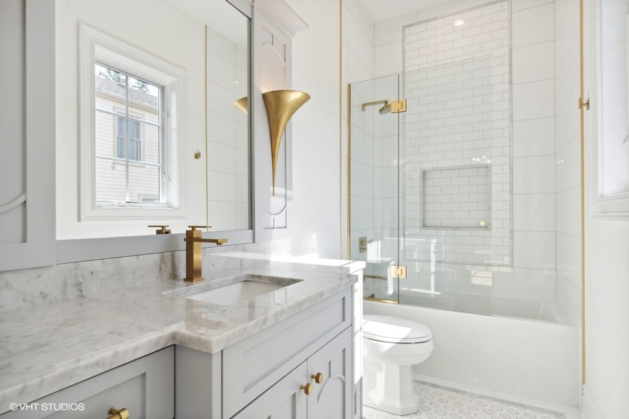 502 Greenwood Road Northbrook, IL 60062 - Photo 43 of 60 a bathroom with a granite countertop sink toilet and shower