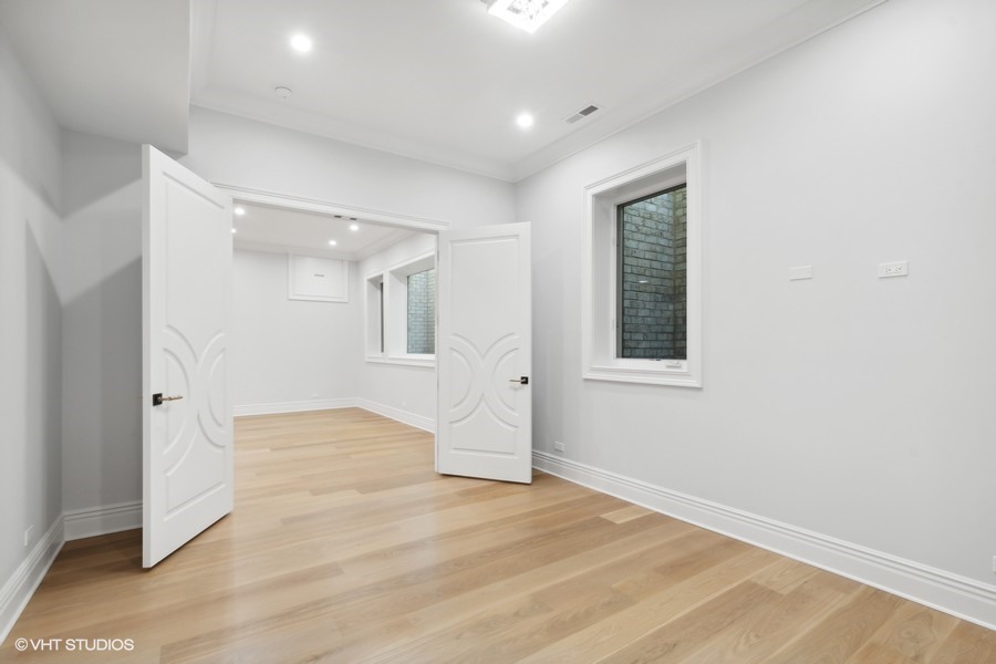 502 Greenwood Road Northbrook, IL 60062 - Photo 49 of 60 a view of an empty room with wooden floor and a window