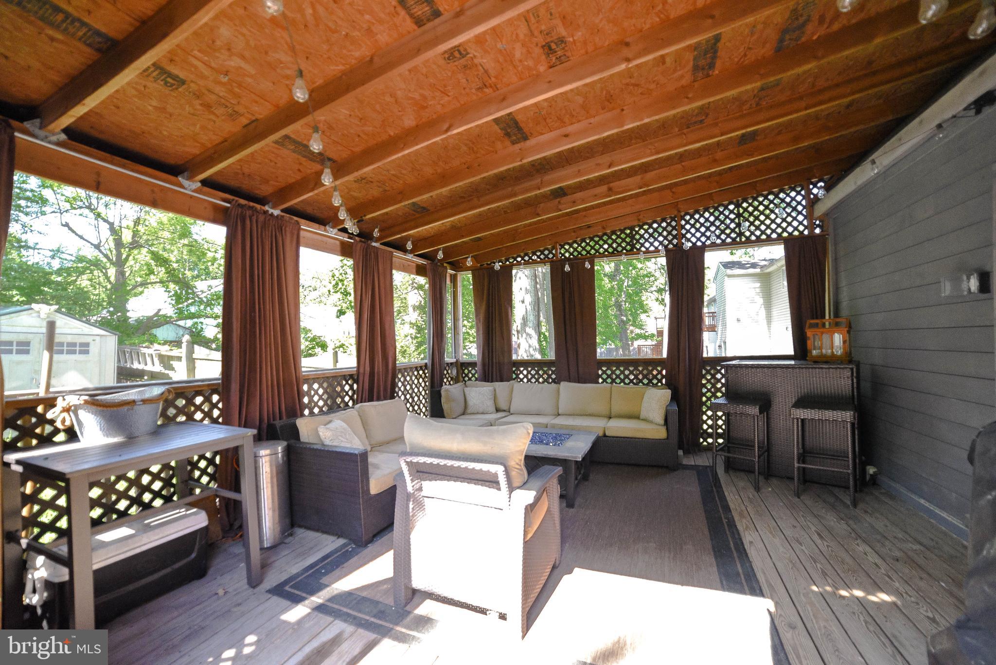 3743 8th Street North Beach, MD 20714 - Photo 11 of 62 screened porch with double doors to deck