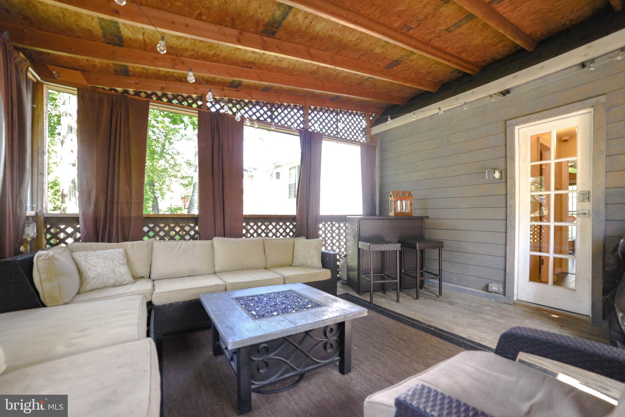 3743 8th Street North Beach, MD 20714 - Photo 7 of 62 Screened porch with attached deck