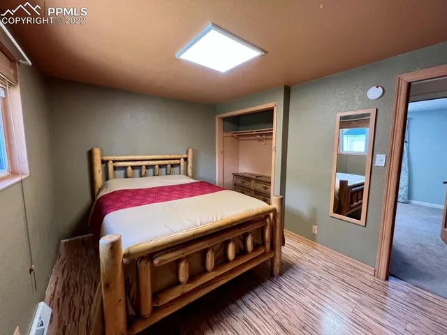 a bedroom with a bed and a dresser