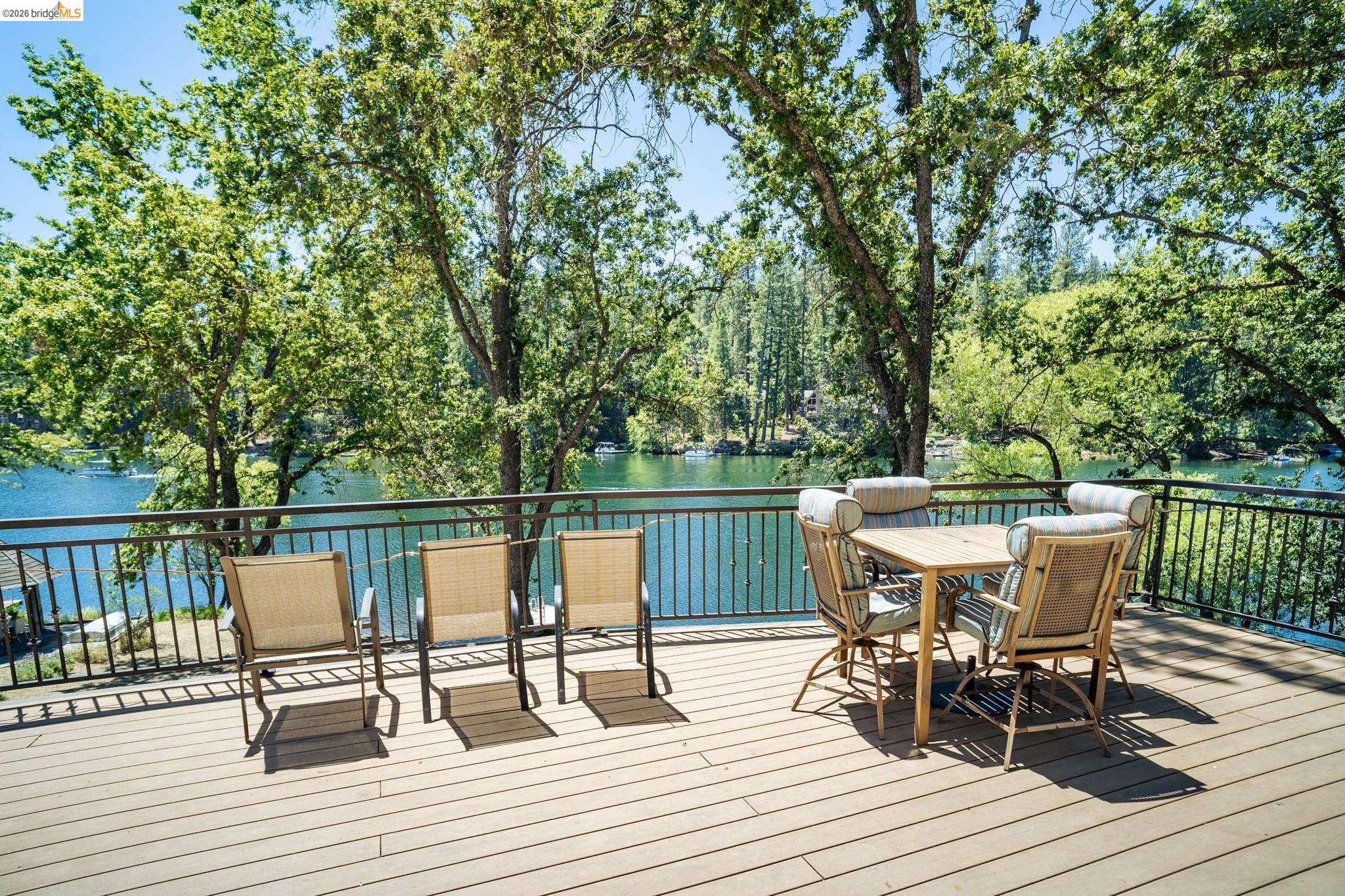 19711 Pleasantview Drive Groveland, CA 95321 - Photo 10 of 39 Expansive outdoor deck featuring wood-finish flooring and a metal railing