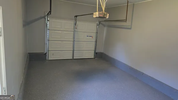 a view of room with window and ceiling fan