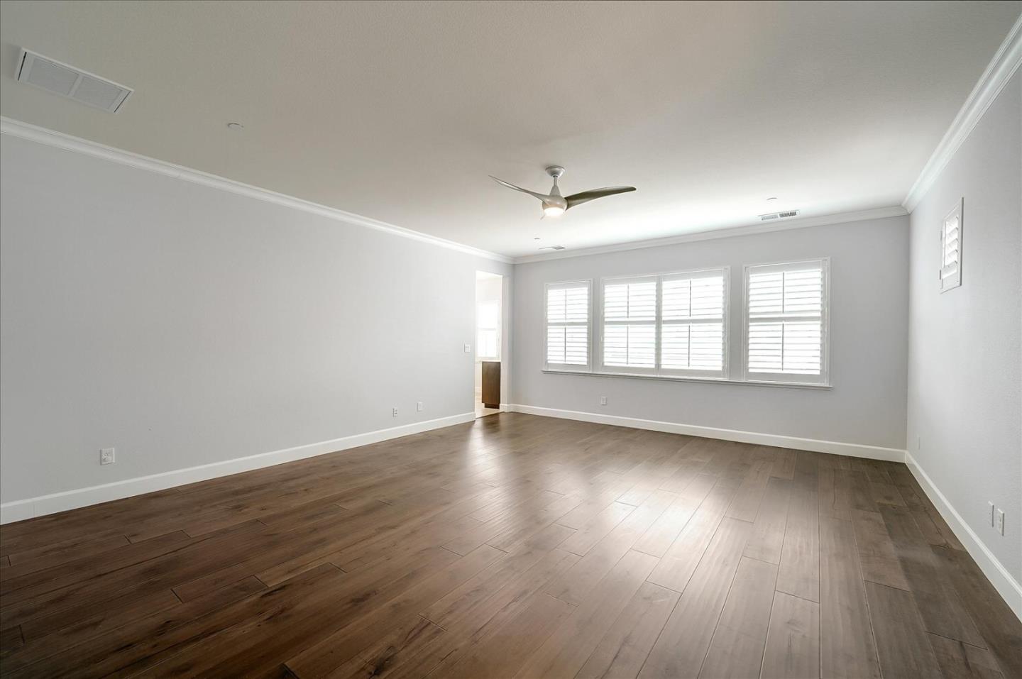 1140 Ruby Way Gilroy, CA 95020 - Photo 25 of 54 an empty room with wooden floor and windows