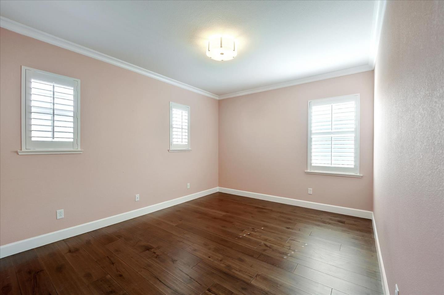 1140 Ruby Way Gilroy, CA 95020 - Photo 34 of 54 an empty room with wooden floor and windows