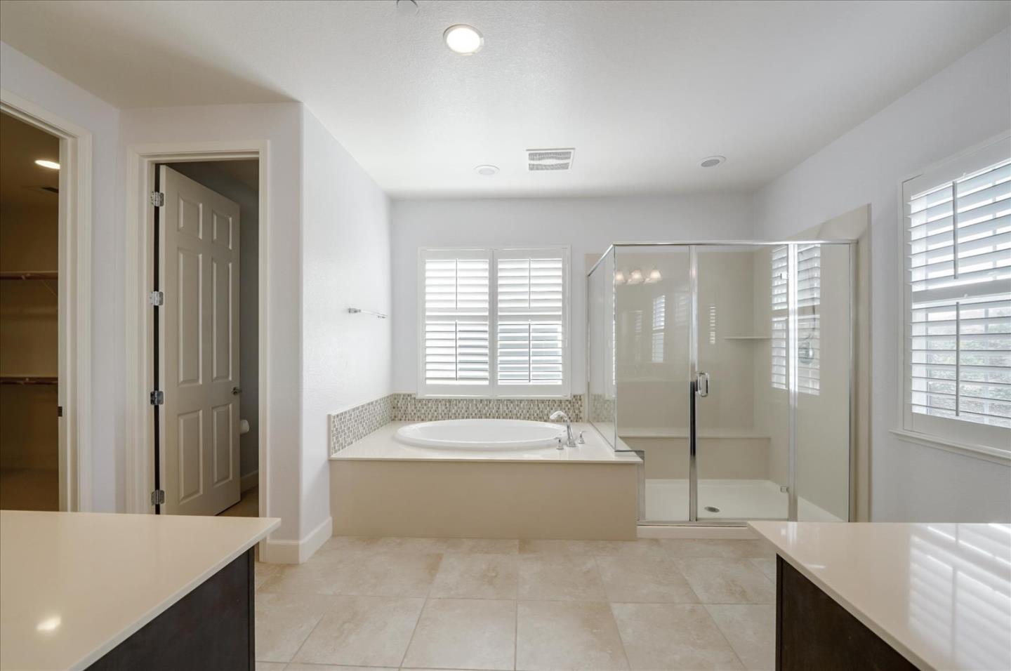 1140 Ruby Way Gilroy, CA 95020 - Photo 44 of 54 a spacious bathroom with a large tub shower and sink