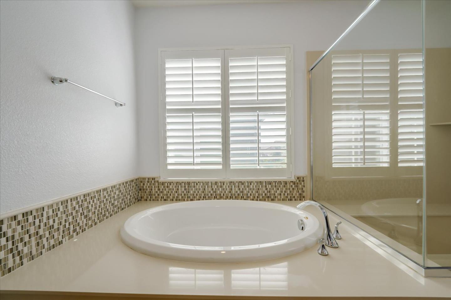 1140 Ruby Way Gilroy, CA 95020 - Photo 45 of 54 a bath tub sitting in a bathroom next to a window