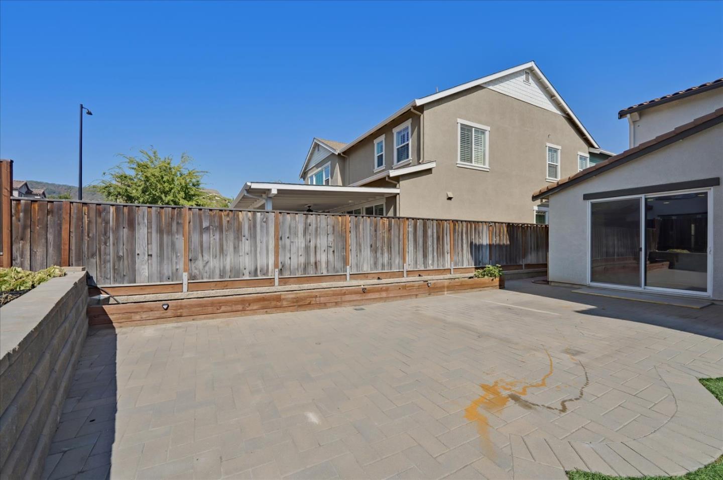 1140 Ruby Way Gilroy, CA 95020 - Photo 52 of 54 a front view of a house with a yard and garage