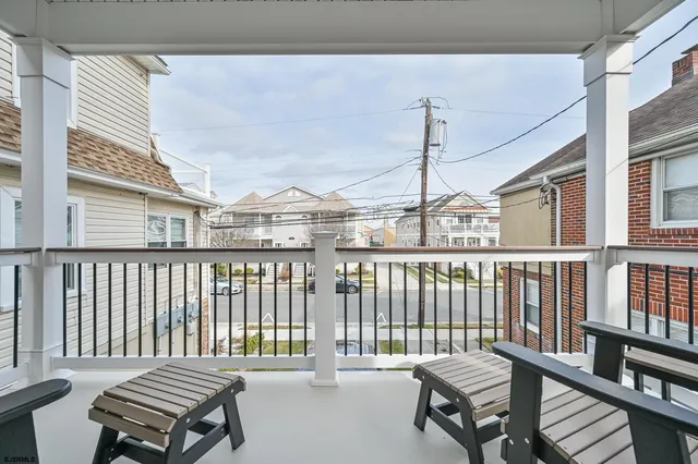 a large kitchen with cabinets and stainless steel appliances