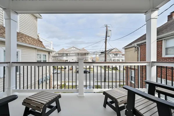 a view of a balcony with furniture