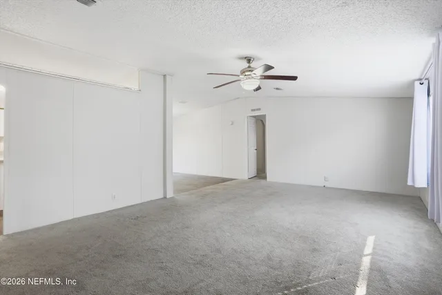 a view of a big room with carpet