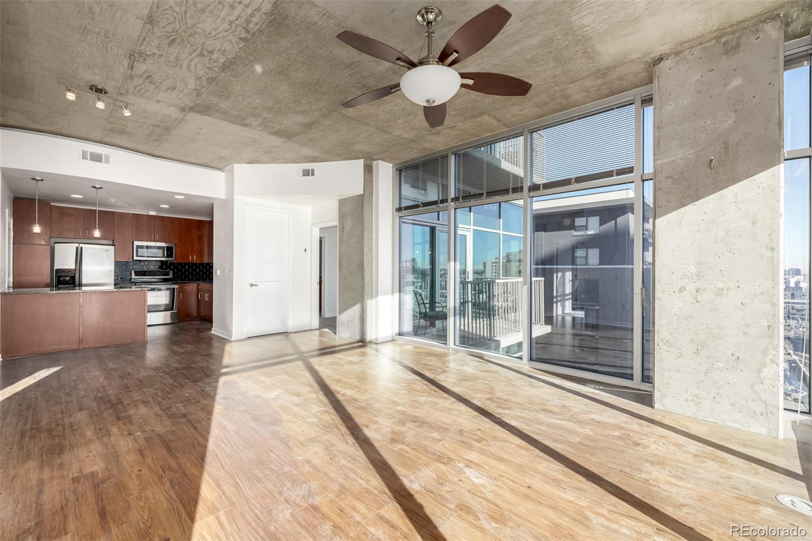 1700 Bassett Street, Unit 1012 Denver, CO 80202 - Photo 17 of 48 a view of interior space with wooden floor and a ceiling fan