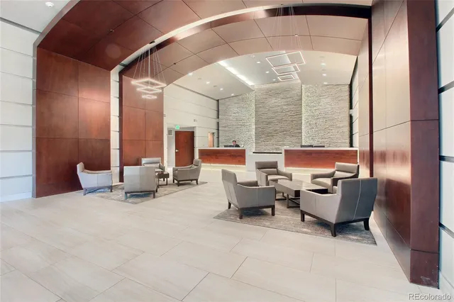 a building outdoor space with patio furniture and a potted plant