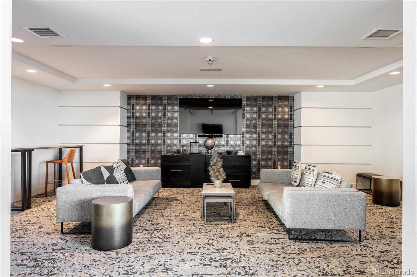 1700 Bassett Street, Unit 1012 Denver, CO 80202 - Photo 39 of 48 a living room with a couch and a fireplace