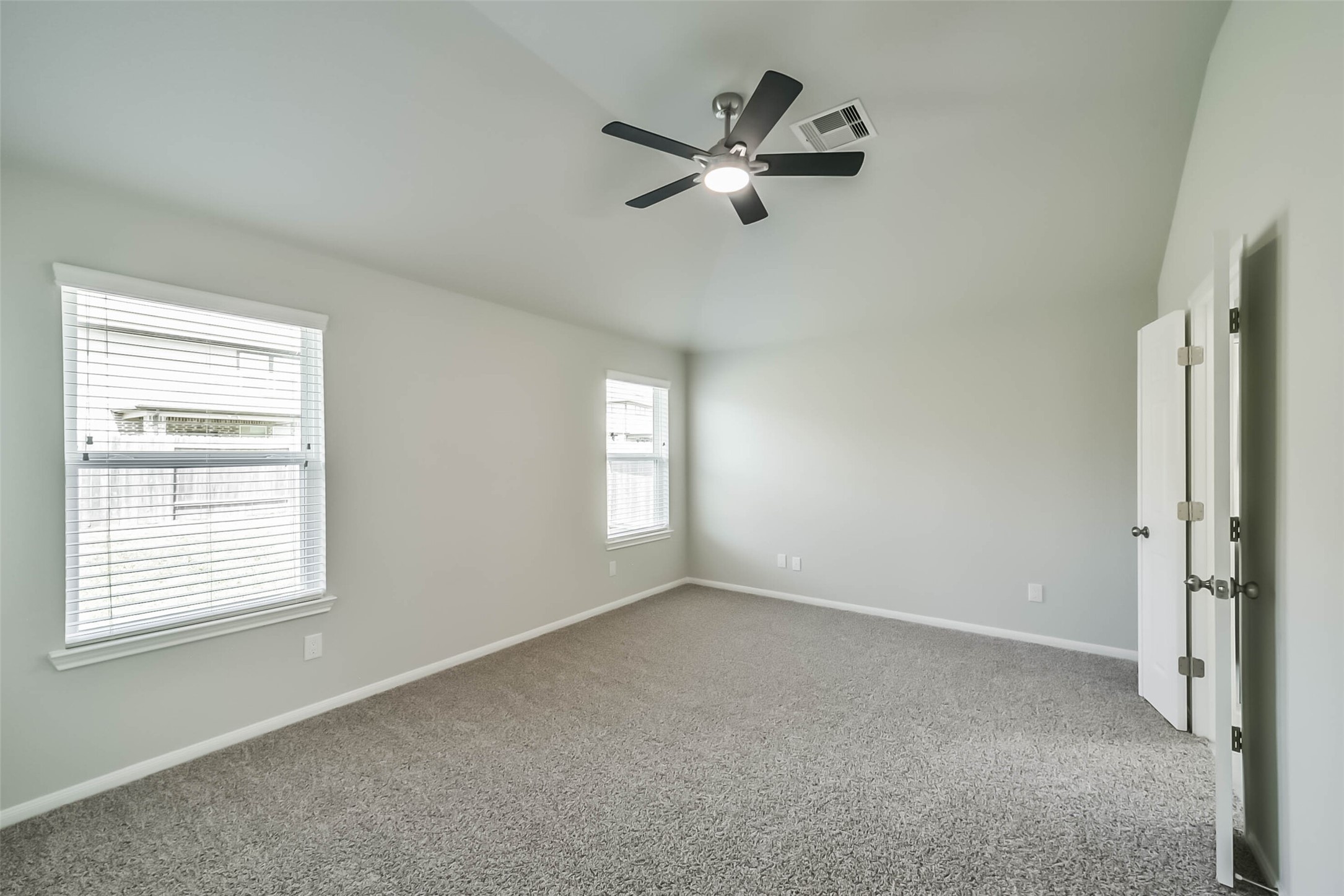 2815 Beech River Court Conroe, TX 77301 - Photo 19 of 34 a view of a livingroom with a ceiling fan and window