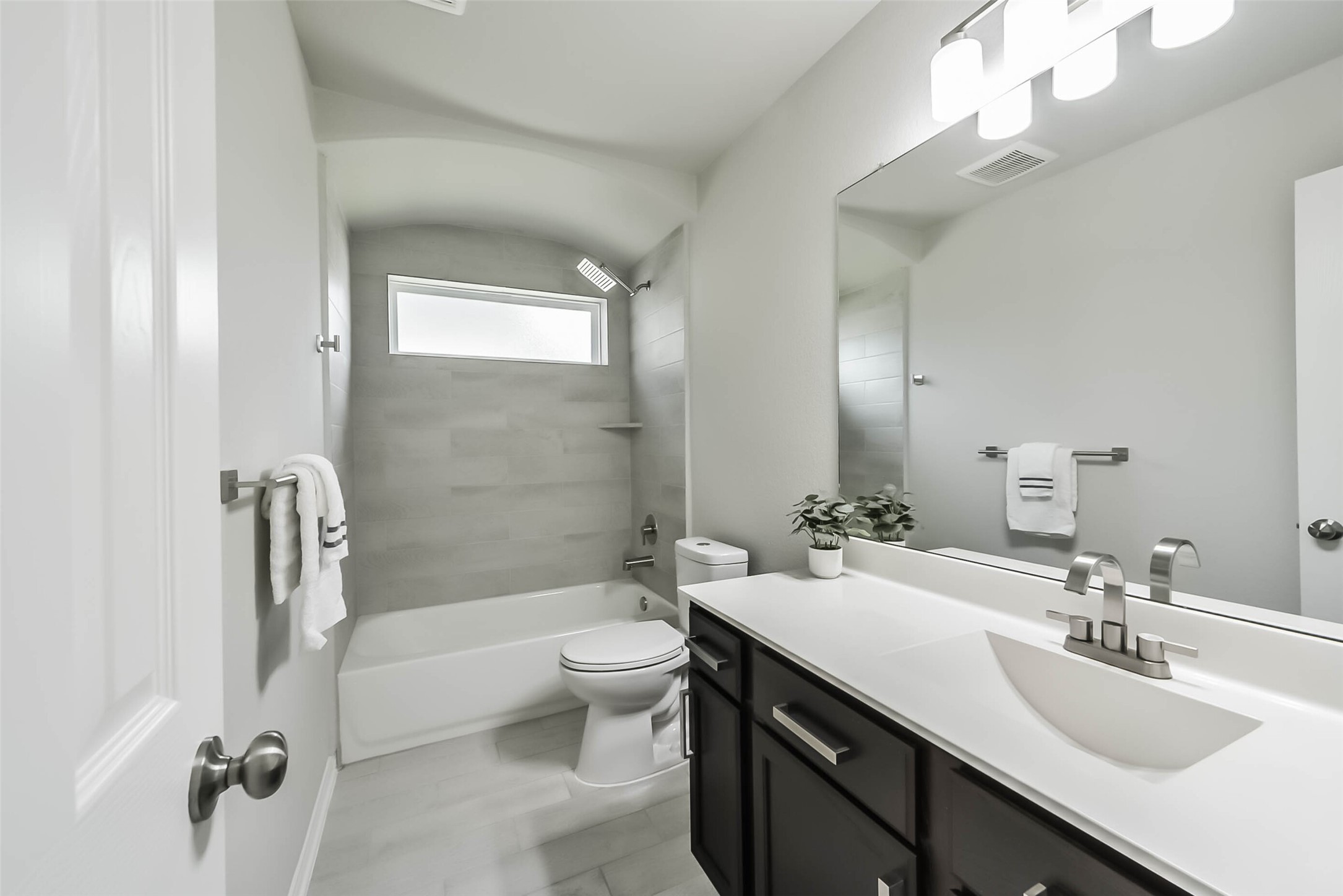 2815 Beech River Court Conroe, TX 77301 - Photo 29 of 34 a bathroom with a double vanity sink toilet mirror and shower