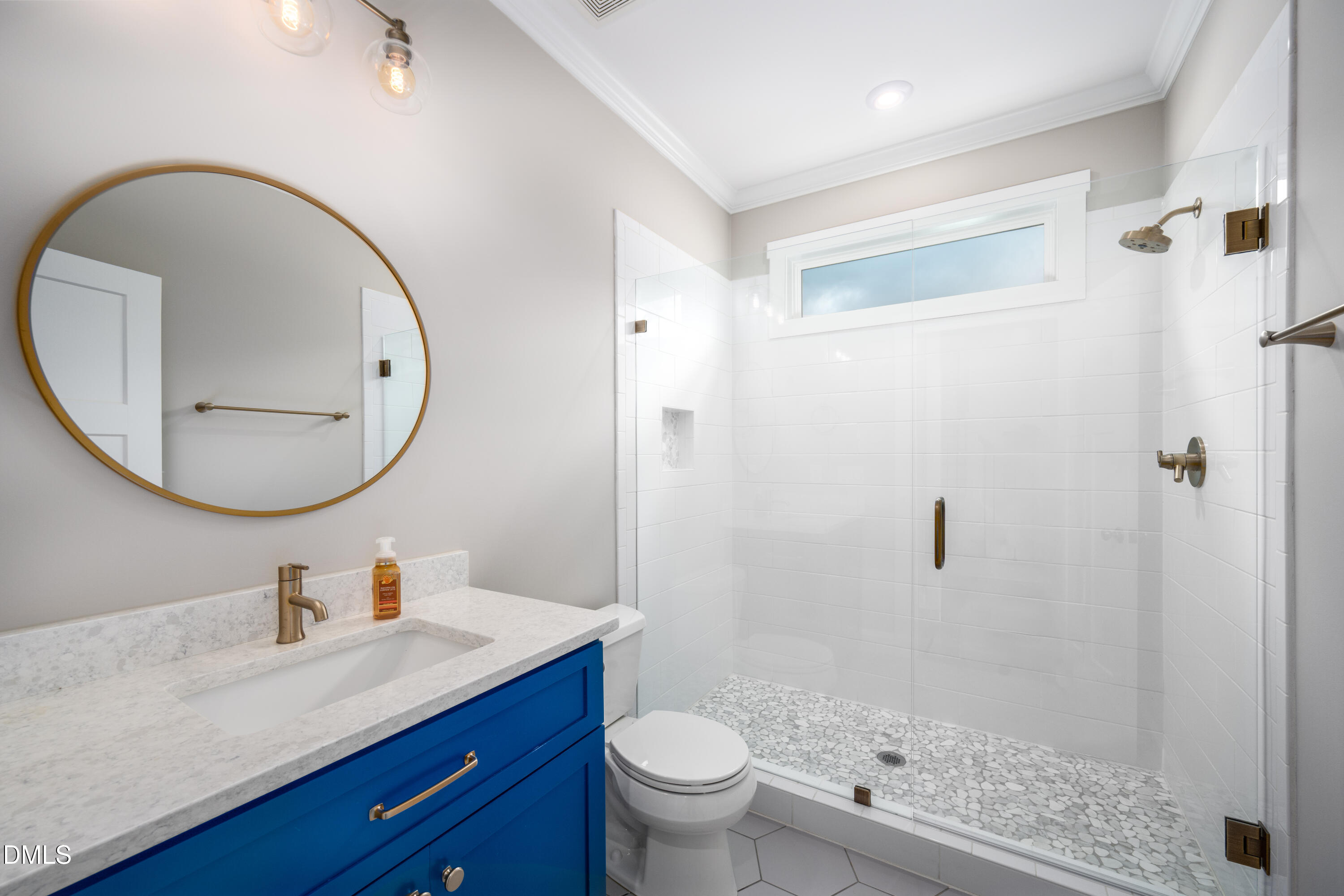 710 Hadley Mill Road Pittsboro, NC 27312 - Photo 18 of 56 a bathroom with a granite countertop sink toilet and a mirror