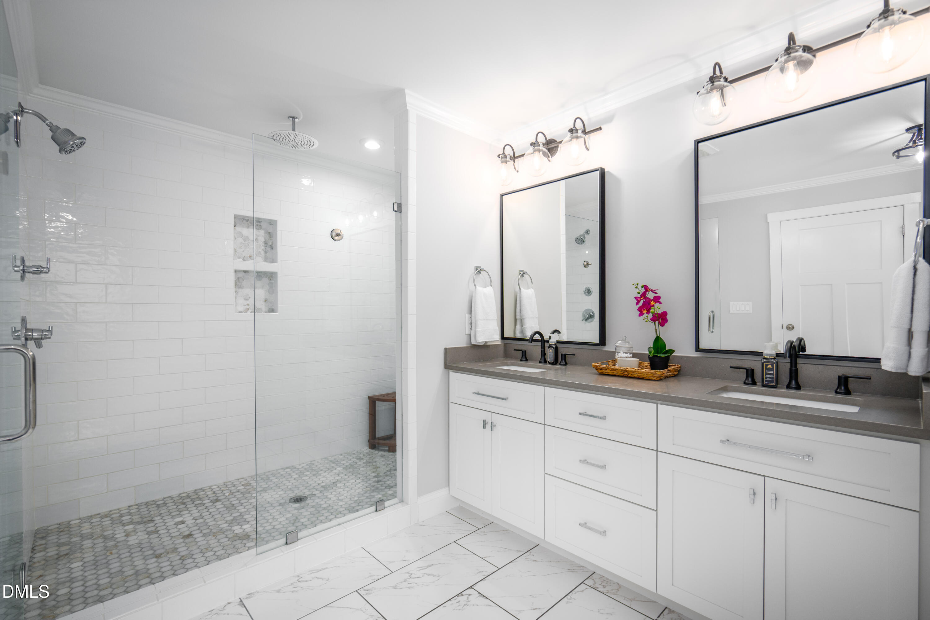 710 Hadley Mill Road Pittsboro, NC 27312 - Photo 25 of 56 a bathroom with double sink and a mirror