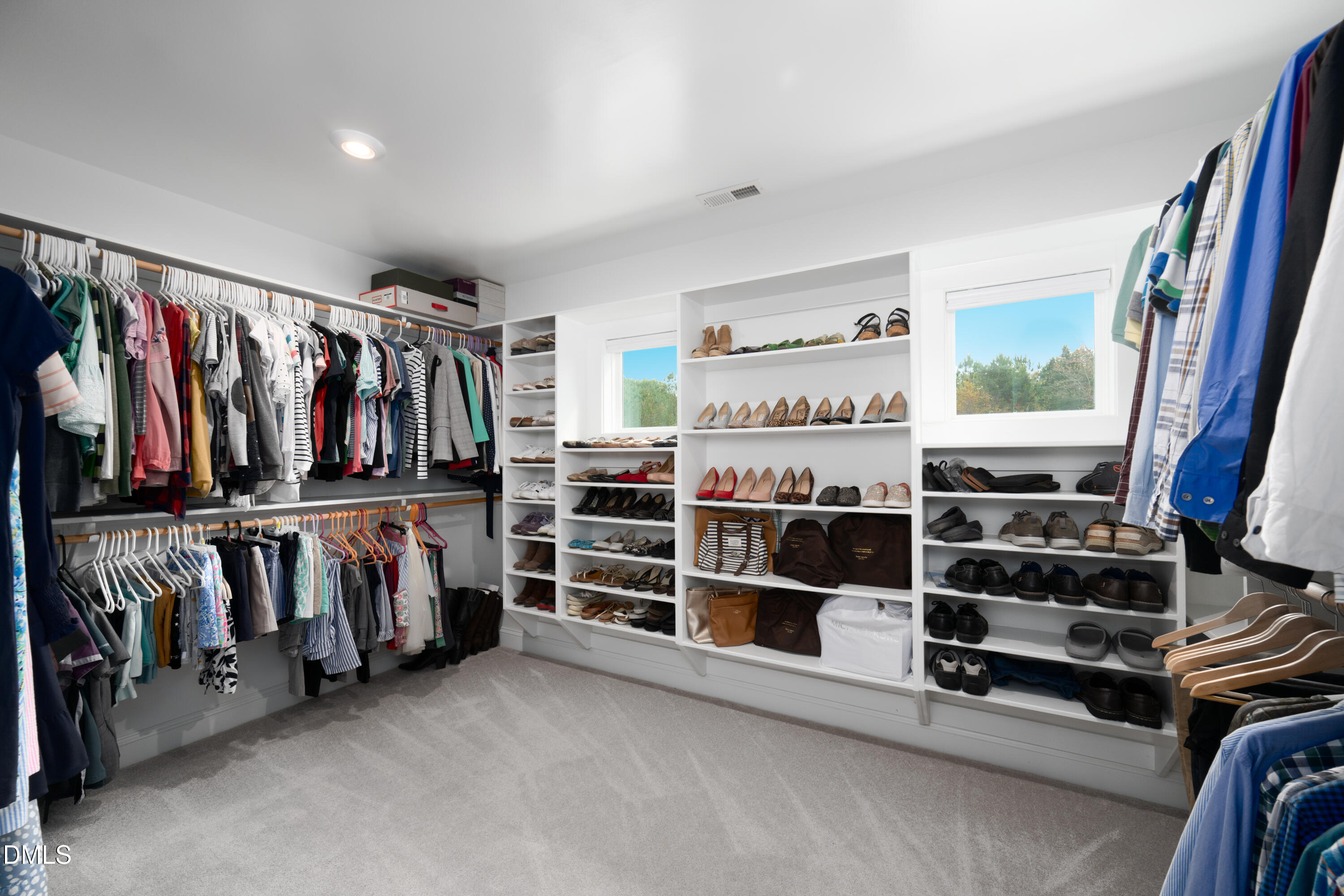 710 Hadley Mill Road Pittsboro, NC 27312 - Photo 28 of 56 a view of walk in closet with clothes and shoes
