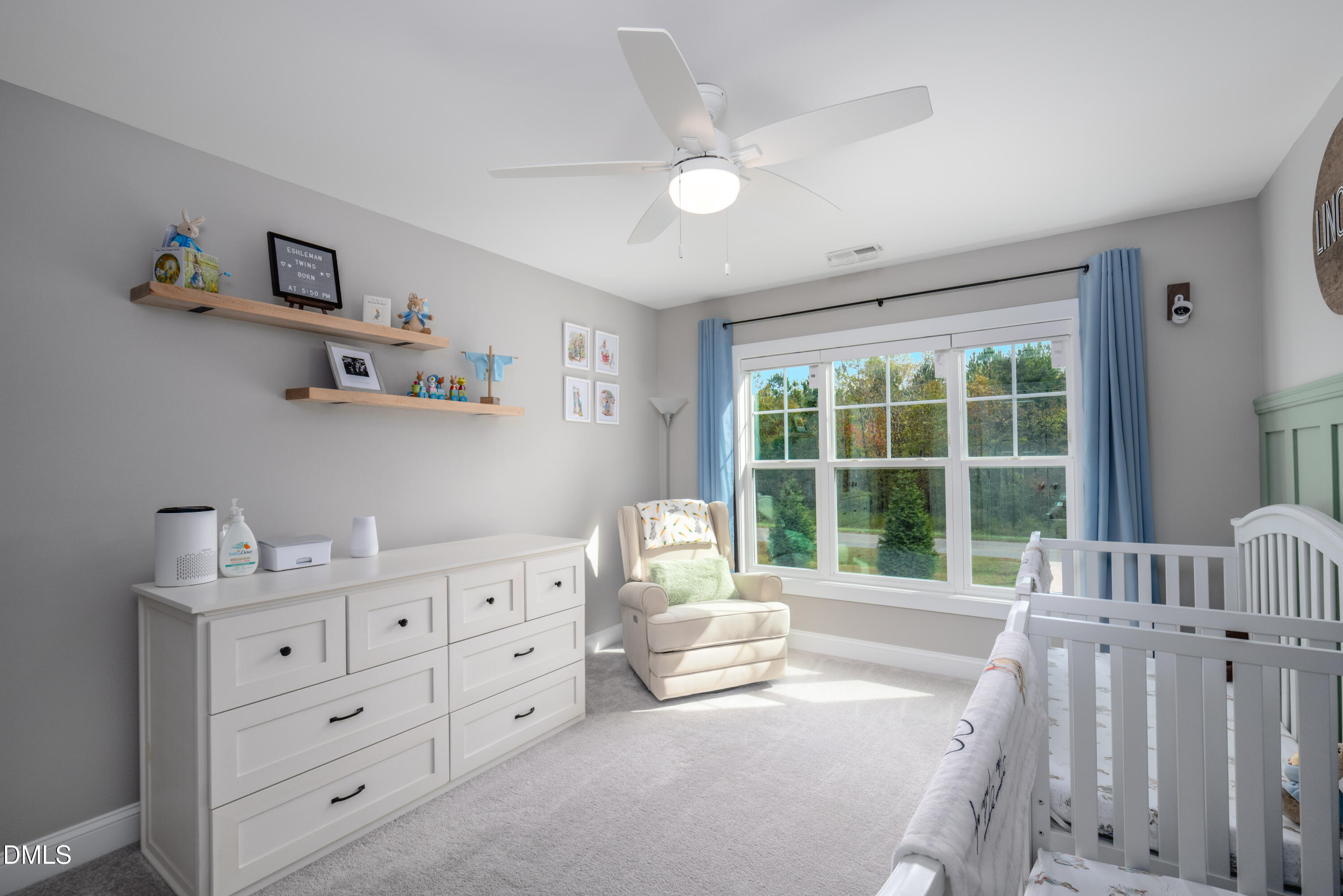 710 Hadley Mill Road Pittsboro, NC 27312 - Photo 30 of 56 a spacious bedroom with a bed and a large window