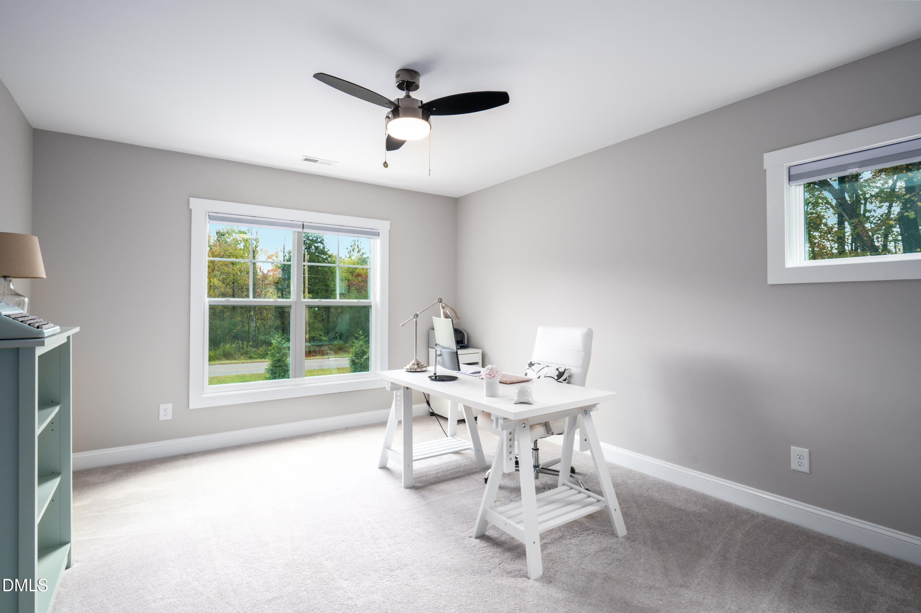 710 Hadley Mill Road Pittsboro, NC 27312 - Photo 31 of 56 a living room with a window and a table