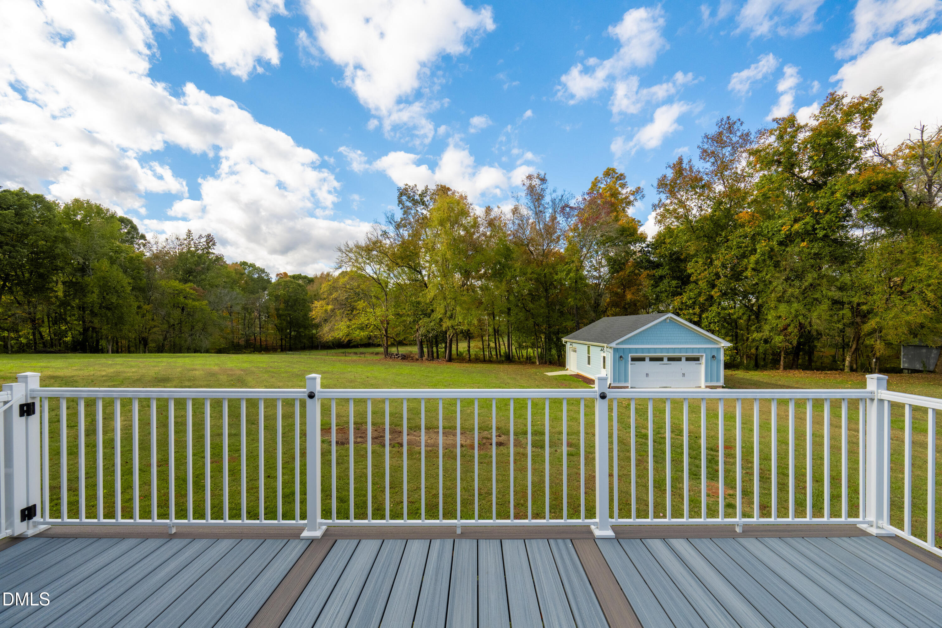 710 Hadley Mill Road Pittsboro, NC 27312 - Photo 40 of 56 a view of a wooden deck and a yard