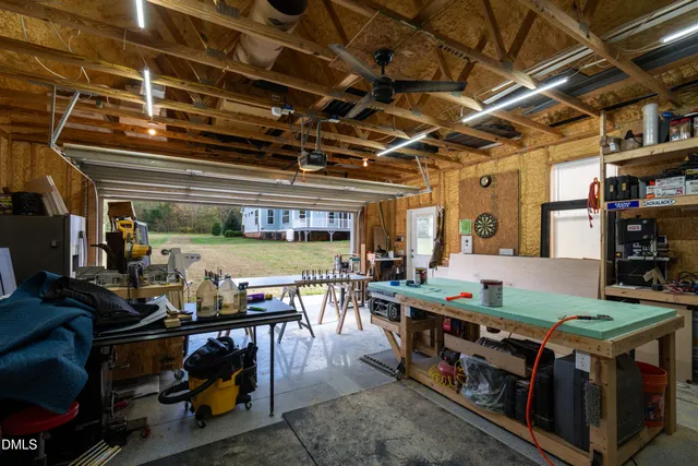 a front view of a house with yard and green space