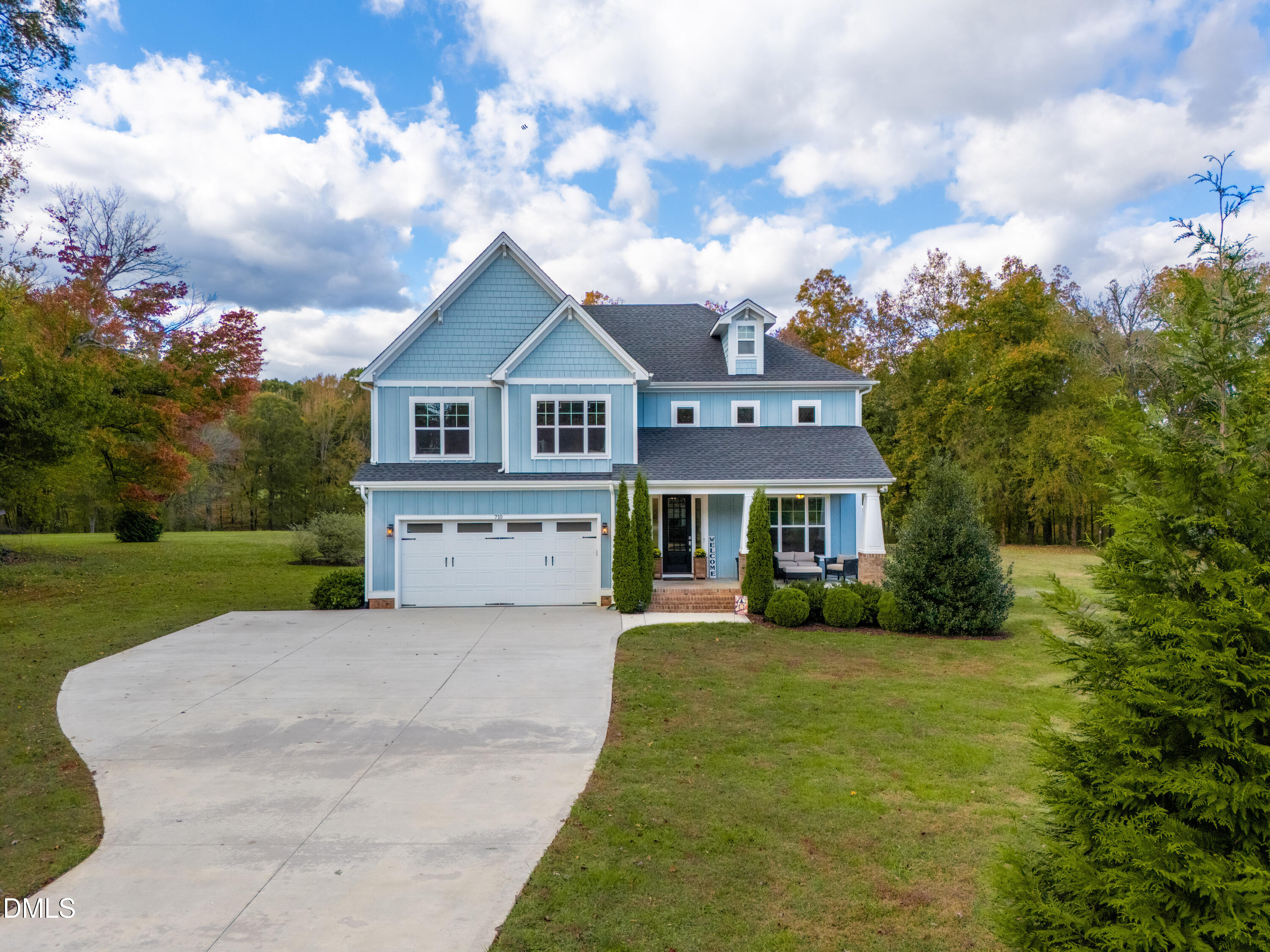 710 Hadley Mill Road Pittsboro, NC 27312 - Photo 48 of 56 a front view of a house with yard and green space